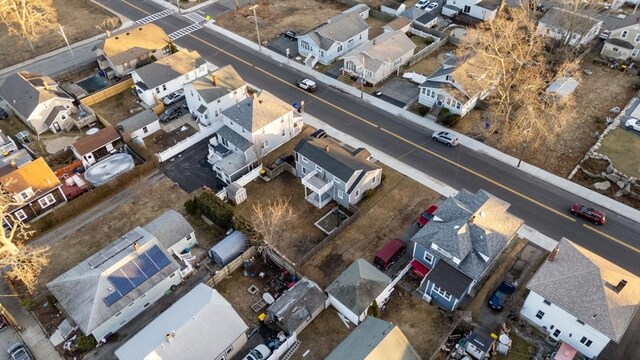 birds eye view of property with a residential view