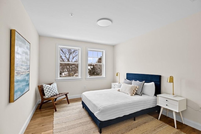 1 Pleasant St Unit 204, Cohasset, MA 02025 - bedroom with light wood finished floors and baseboards