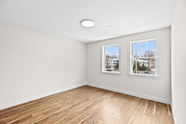 1 Pleasant St Unit 204, Cohasset, MA 02025 - spare room featuring light wood-style flooring and baseboards