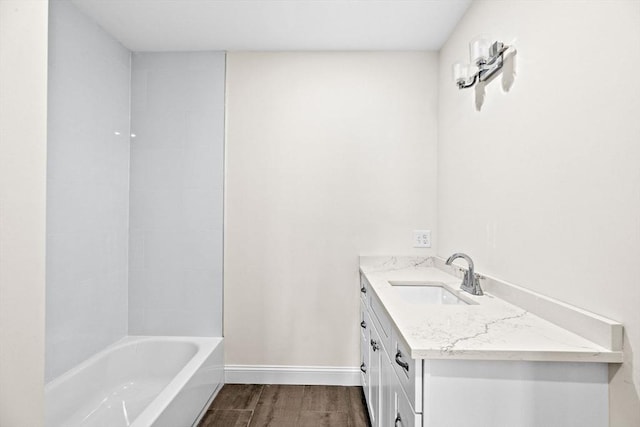 1 Pleasant St Unit 204, Cohasset, MA 02025 - full bathroom with vanity, baseboards, and wood finished floors