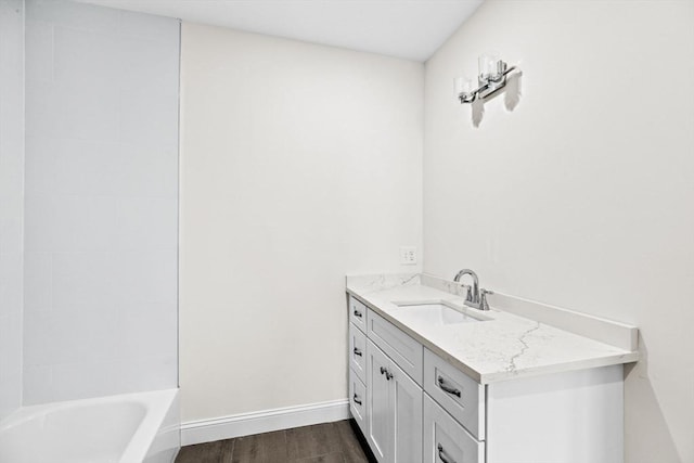 1 Pleasant St Unit 204, Cohasset, MA 02025 - bathroom featuring bathtub / shower combination, baseboards, wood finished floors, and vanity