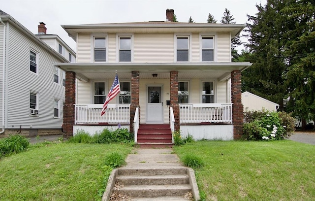 82 Worcester St, West Springfield, MA 01089 - traditional style home featuring a porch, a front lawn, and a chimney