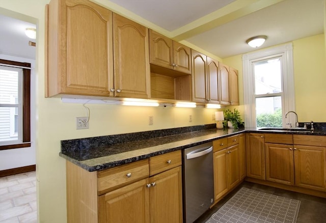 82 Worcester St, West Springfield, MA 01089 - kitchen with stainless steel dishwasher, a sink, dark stone countertops, and baseboards