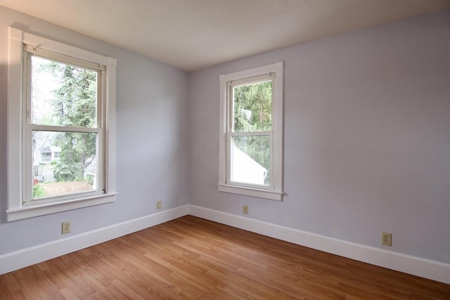 82 Worcester St, West Springfield, MA 01089 - empty room with plenty of natural light, baseboards, and light wood-type flooring