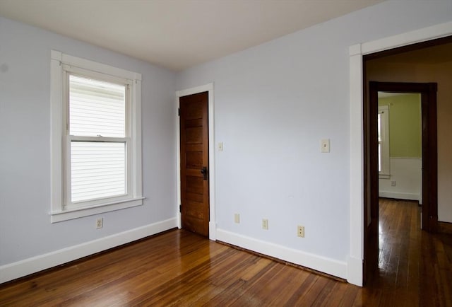 82 Worcester St, West Springfield, MA 01089 - spare room featuring dark wood-style floors, baseboards, and plenty of natural light