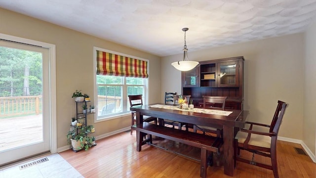 659 Sherman Farm Rd, Burrillville, RI 02830 - dining space with light wood-style floors and baseboards