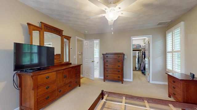 659 Sherman Farm Rd, Burrillville, RI 02830 - bedroom with baseboards, light carpet, a walk in closet, a closet, and ceiling fan