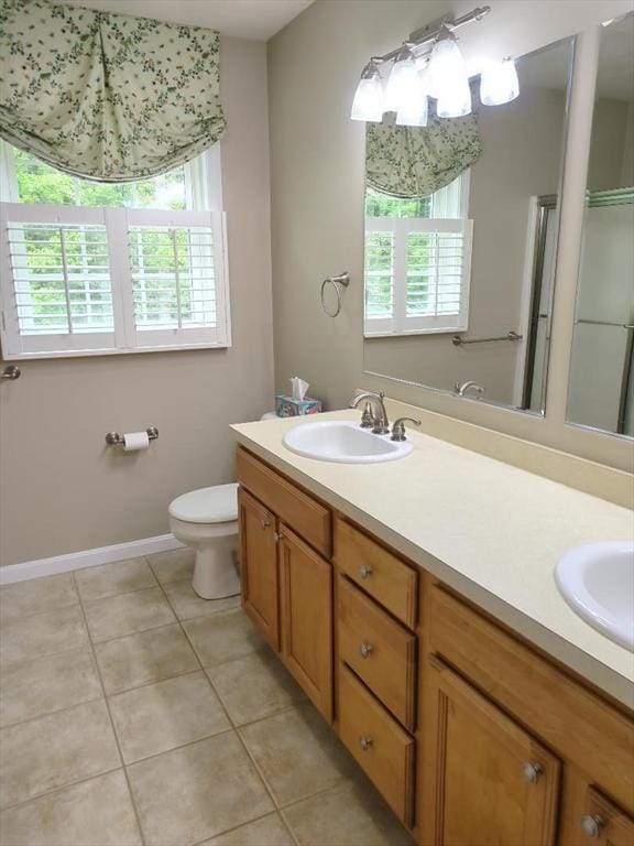 659 Sherman Farm Rd, Burrillville, RI 02830 - bathroom with tile patterned flooring, double vanity, and toilet