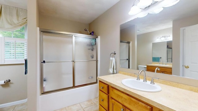 659 Sherman Farm Rd, Burrillville, RI 02830 - full bath featuring tile patterned flooring, vanity, bath / shower combo with glass door, and toilet