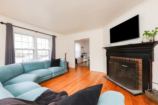 living room featuring ornamental molding and wood-type flooring