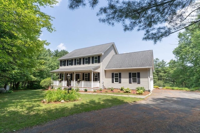 9 Old Poor Farm Rd, Ware, MA 01082 - colonial house with a porch, asphalt driveway, and a front lawn