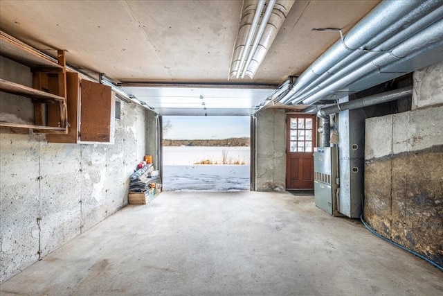 misc room featuring heating unit and concrete floors