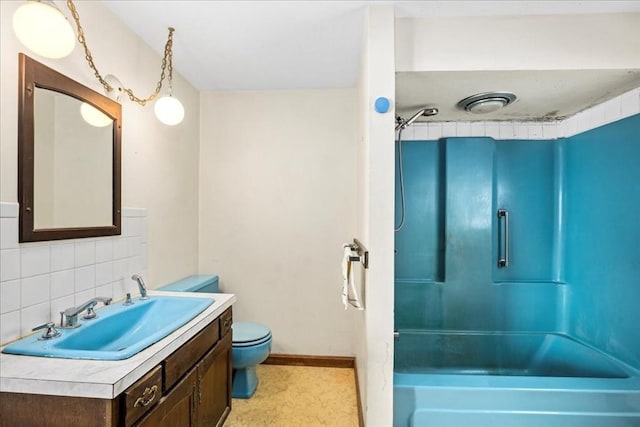 full bathroom with tasteful backsplash, shower / washtub combination, toilet, and vanity