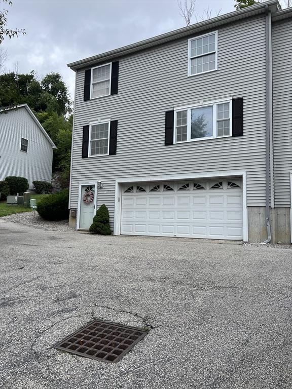 view of side of home with a garage