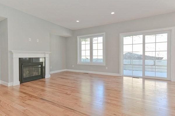 unfurnished living room featuring light hardwood / wood-style floors