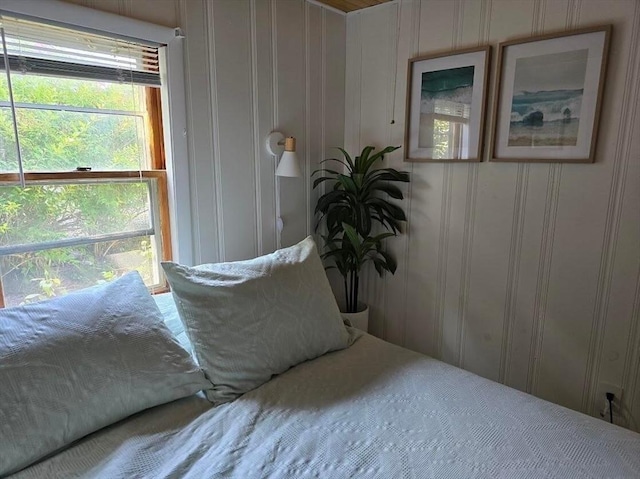 bedroom with a decorative wall