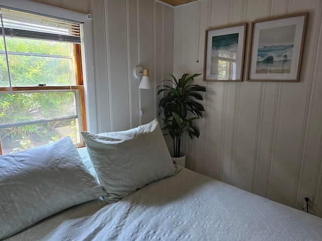 bedroom with multiple windows