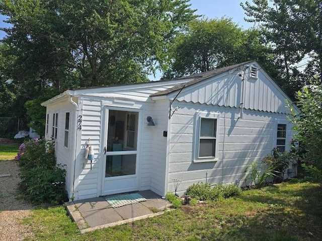 rear view of property with board and batten siding