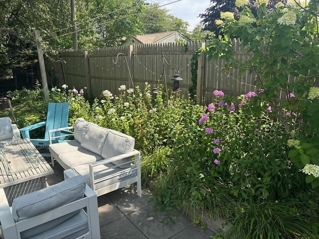 view of patio with outdoor lounge area and fence