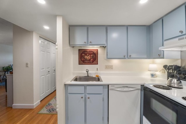 49 Melrose St Unit 4E, Melrose, MA 02176 - kitchen featuring white dishwasher, electric stove, a sink, under cabinet range hood, and light wood-type flooring