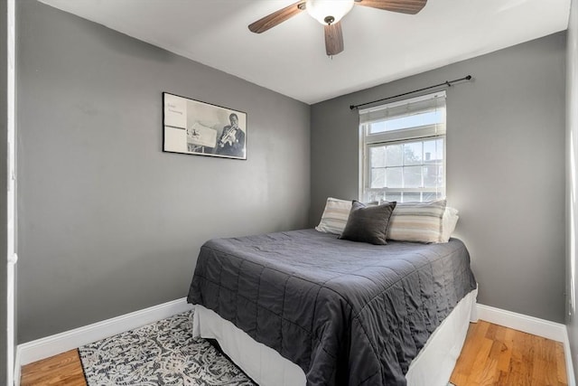 bedroom featuring ceiling fan and wood-type flooring