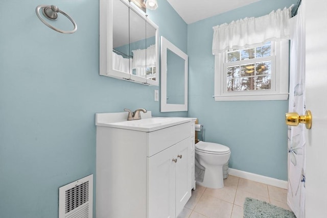 bathroom with vanity, tile patterned floors, and toilet