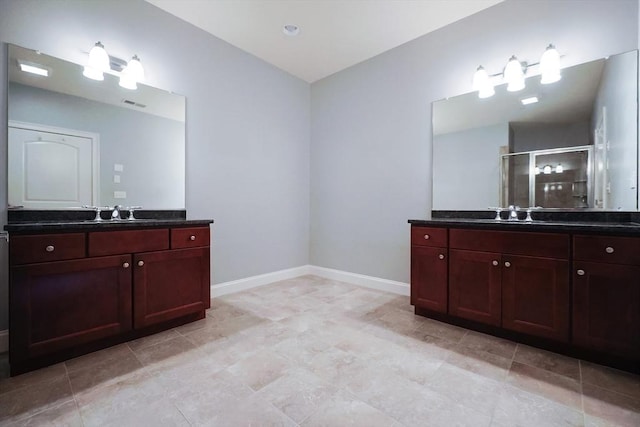 bathroom with vanity and an enclosed shower