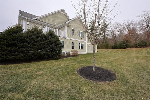 view of side of home featuring a yard