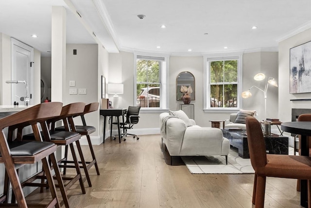407 Shawmut Ave Unit 1, Boston, MA 02118 - living room with light wood-style flooring, ornamental molding, recessed lighting, and a tile fireplace