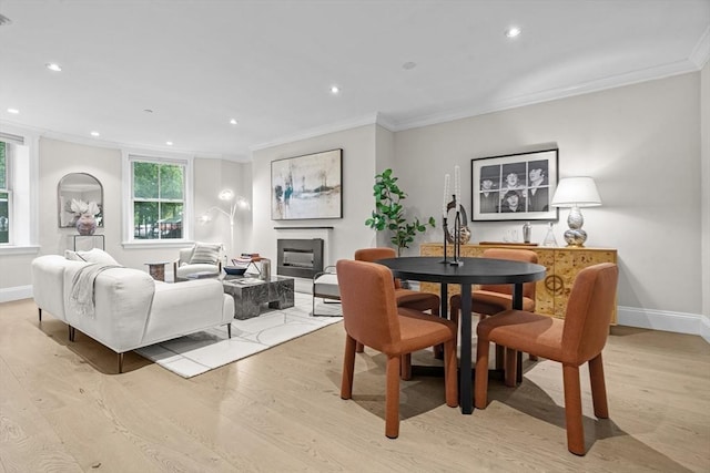 407 Shawmut Ave Unit 1, Boston, MA 02118 - dining space featuring light wood-style floors, ornamental molding, a fireplace, and recessed lighting