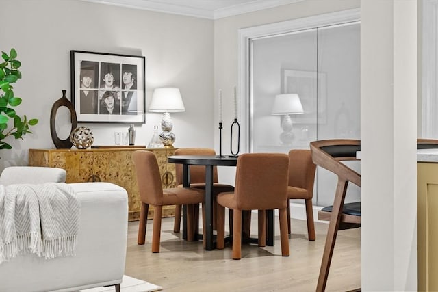407 Shawmut Ave Unit 1, Boston, MA 02118 - dining space featuring a bar, wood finished floors, and crown molding