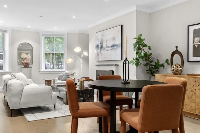 407 Shawmut Ave Unit 1, Boston, MA 02118 - dining room with healthy amount of natural light, light wood-type flooring, ornamental molding, recessed lighting, and a fireplace