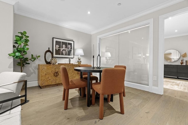 407 Shawmut Ave Unit 1, Boston, MA 02118 - dining area with light wood-type flooring, ornamental molding, recessed lighting, and a baseboard heating unit