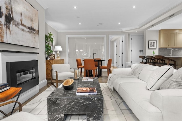 407 Shawmut Ave Unit 1, Boston, MA 02118 - living room with recessed lighting, a glass covered fireplace, ornamental molding, and light wood finished floors
