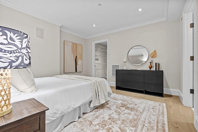 407 Shawmut Ave Unit 1, Boston, MA 02118 - bedroom featuring wood finished floors, crown molding, recessed lighting, and a walk in closet