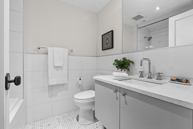 407 Shawmut Ave Unit 1, Boston, MA 02118 - full bathroom with tile walls, vanity, tile patterned flooring, and recessed lighting