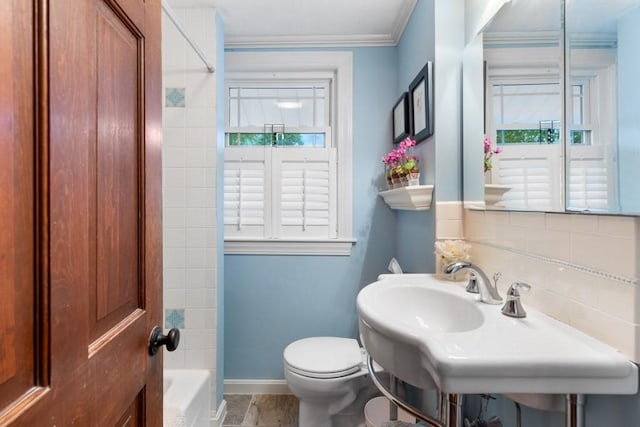 19 Beal Rd, Waltham, MA 02453 - full bathroom featuring toilet, baseboards, a sink, ornamental molding, and washtub / shower combination