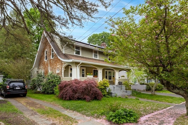 19 Beal Rd, Waltham, MA 02453 - view of front of house with a porch, a chimney, a front yard, a shingled roof, and driveway