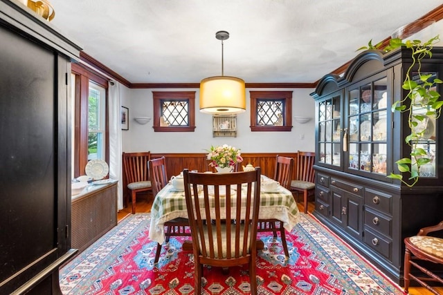 19 Beal Rd, Waltham, MA 02453 - dining room with crown molding, a wainscoted wall, and wood finished floors