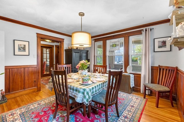19 Beal Rd, Waltham, MA 02453 - dining room featuring healthy amount of natural light, a wainscoted wall, light wood-style floors, crown molding, and wood walls