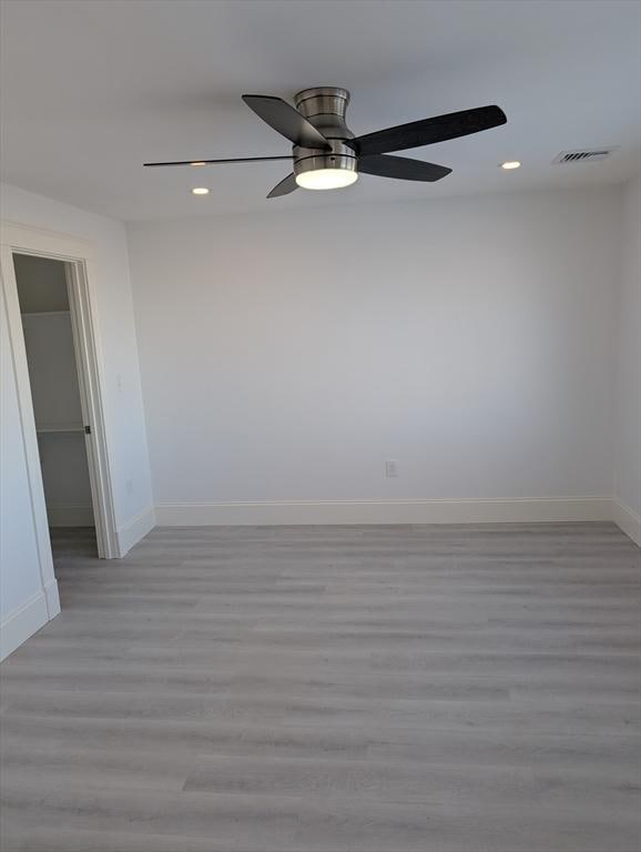 spare room with visible vents, baseboards, ceiling fan, recessed lighting, and light wood-style floors