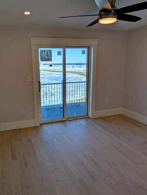 unfurnished room featuring recessed lighting, baseboards, light wood-style floors, and a ceiling fan