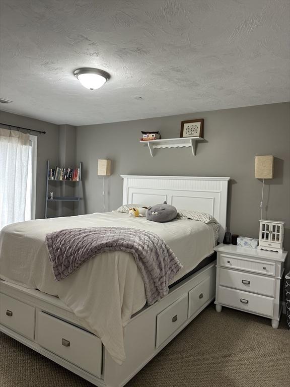 83C Maple Ave Unit C, Rutland, MA 01543 - bedroom with dark carpet and a textured ceiling