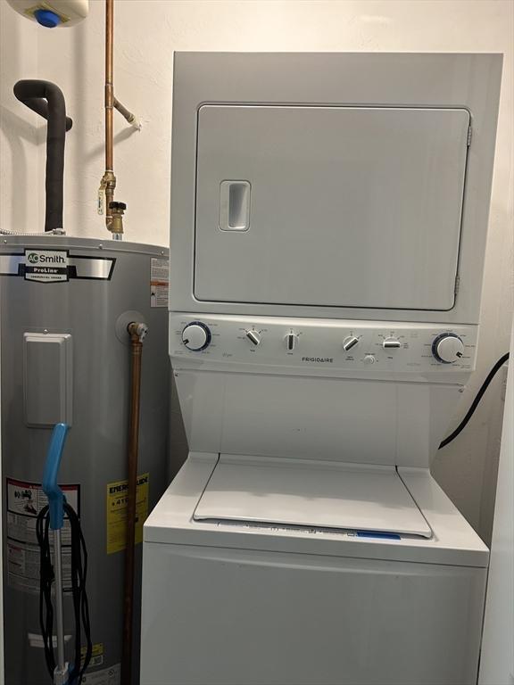 83C Maple Ave Unit C, Rutland, MA 01543 - laundry area with water heater and stacked washer / drying machine