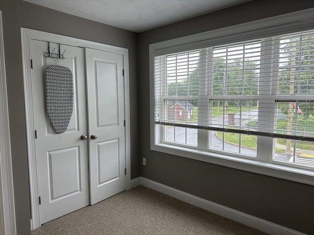 83C Maple Ave Unit C, Rutland, MA 01543 - unfurnished bedroom with multiple windows, light colored carpet, and a closet