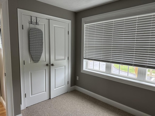83C Maple Ave Unit C, Rutland, MA 01543 - unfurnished bedroom featuring a closet, multiple windows, and light carpet