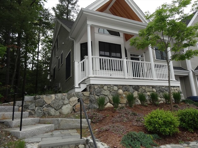 83 Johnson Woods Dr Unit 83, Reading, MA 01867 - view of front of home with a porch and stone siding