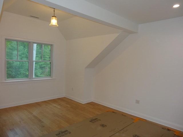 83 Johnson Woods Dr Unit 83, Reading, MA 01867 - additional living space featuring vaulted ceiling, light wood finished floors, baseboards, and recessed lighting