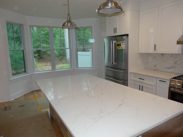 83 Johnson Woods Dr Unit 83, Reading, MA 01867 - kitchen featuring stainless steel appliances, white cabinetry, light stone countertops, and tasteful backsplash