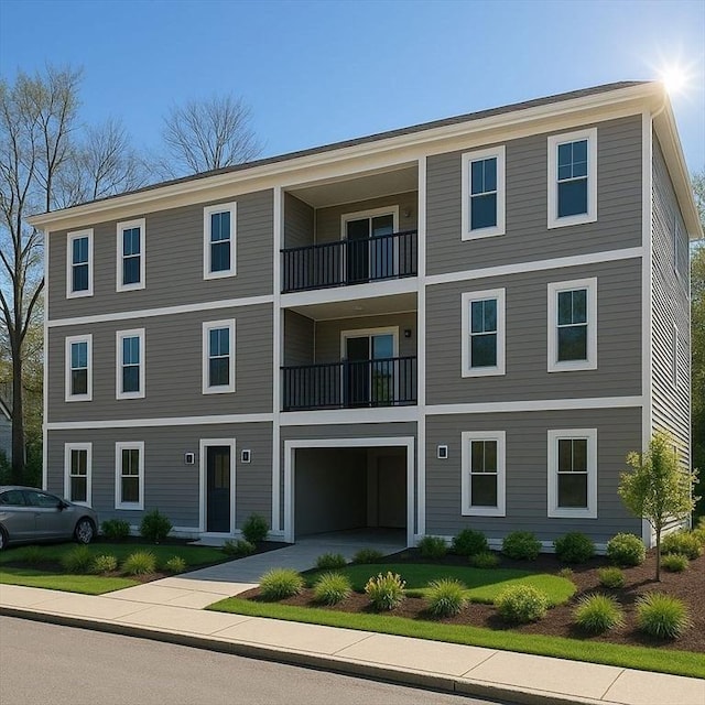 43-47 Fremont Unit 9, Boston, MA 02126 - view of building exterior featuring a garage and driveway